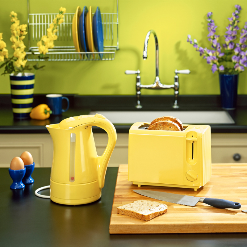 Diverse collection of kitchen appliances featuring essential tools such as dough kneaders, ice cream makers, air fryers, toasters, sandwich presses, waffle machines, food choppers, blenders, food processors, and essential kitchenware for culinary enthusiasts.